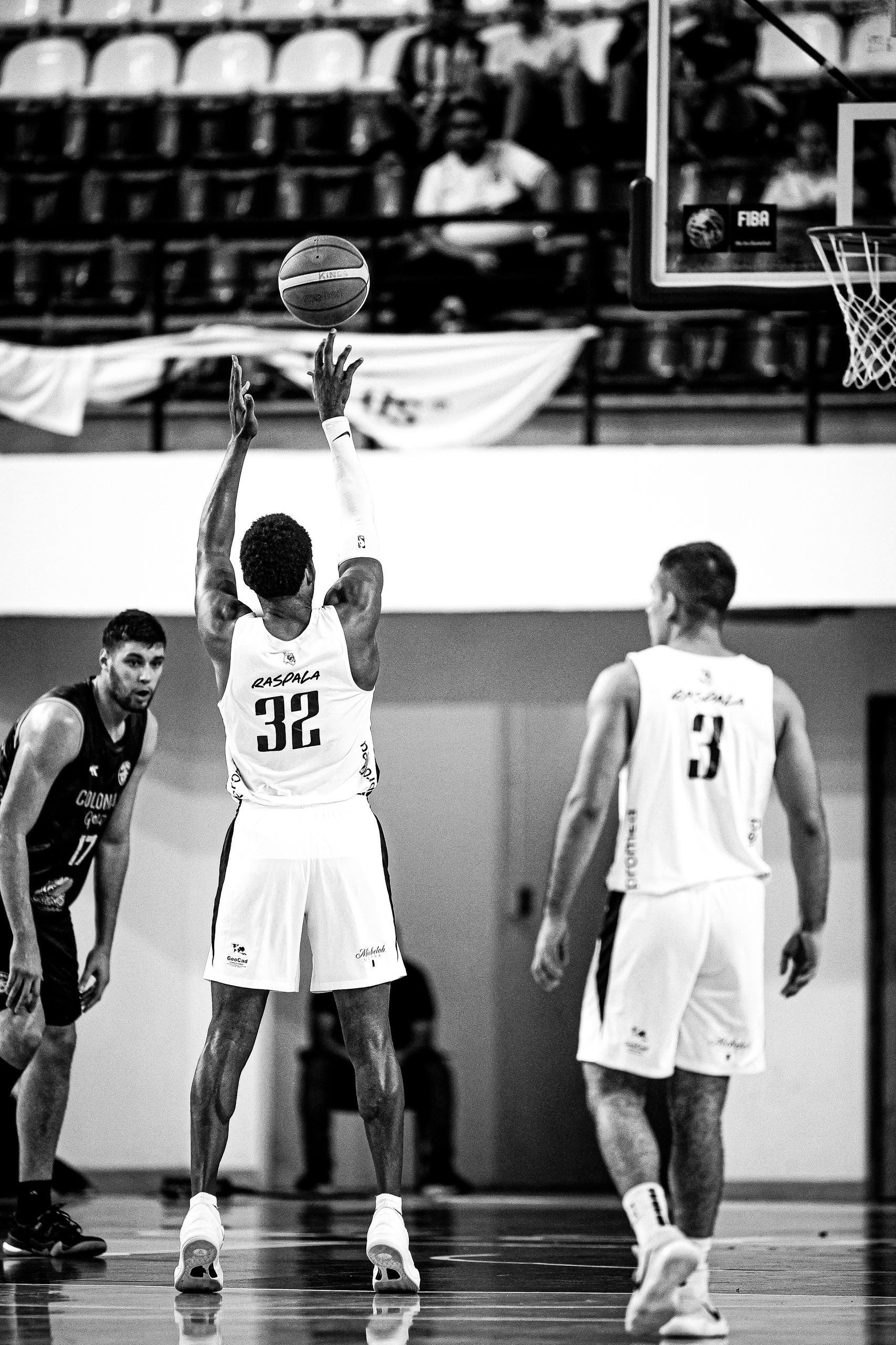 Black and white shot of a basketball game in Paraguay, highlighting athletic performance.